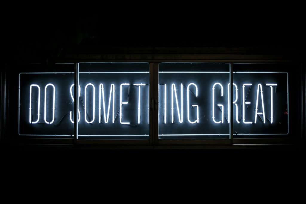 Neon sign reading Do Something Great