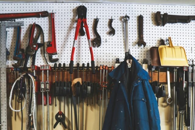Pegboard wall of hand tools, clamps and wrenches, each hung in its own place