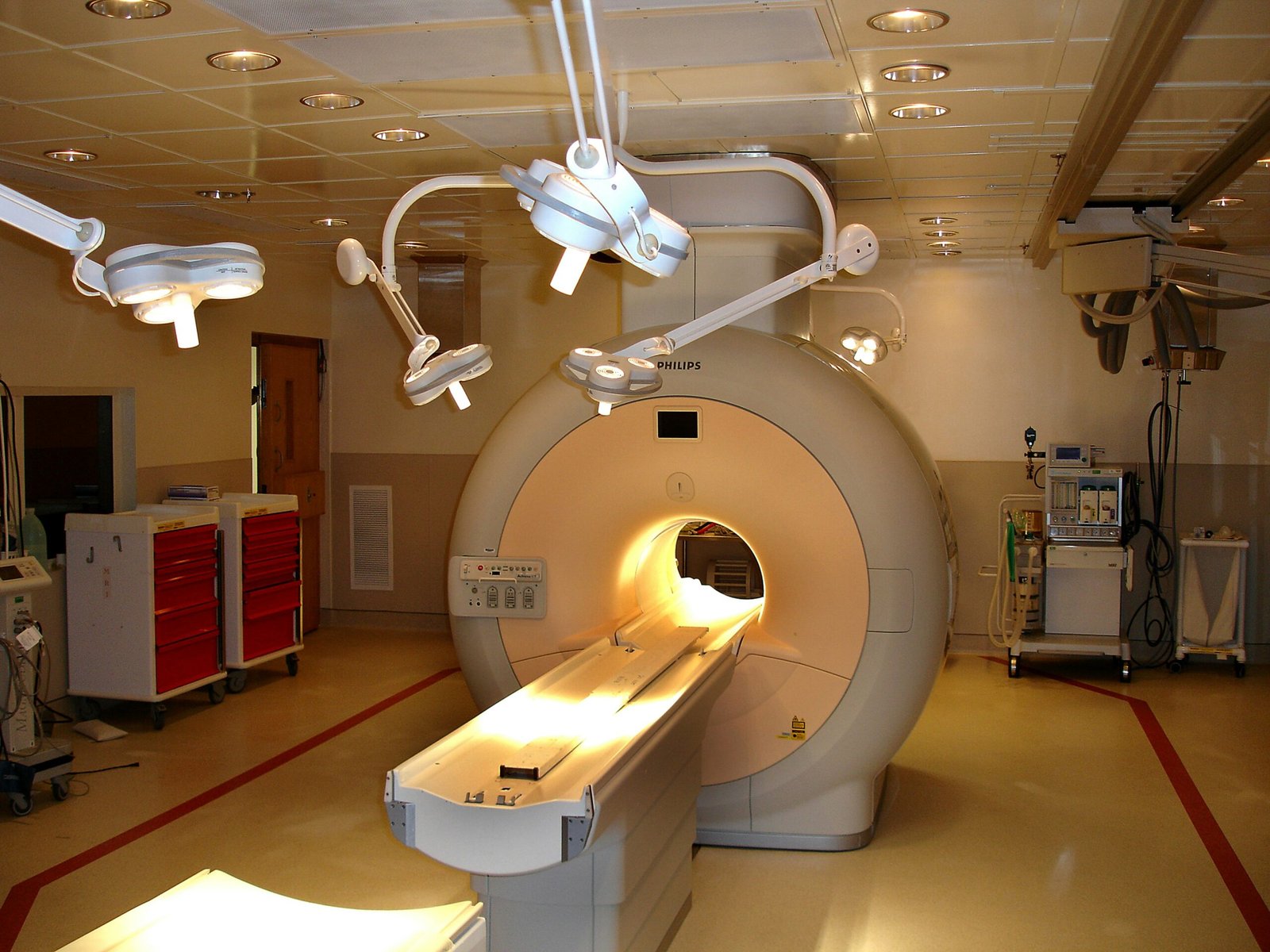 MRI scanner room with overhead imaging equipment